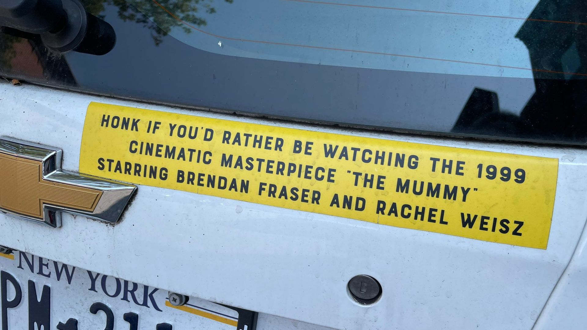 Bumper sticker on a car with a New York license plate