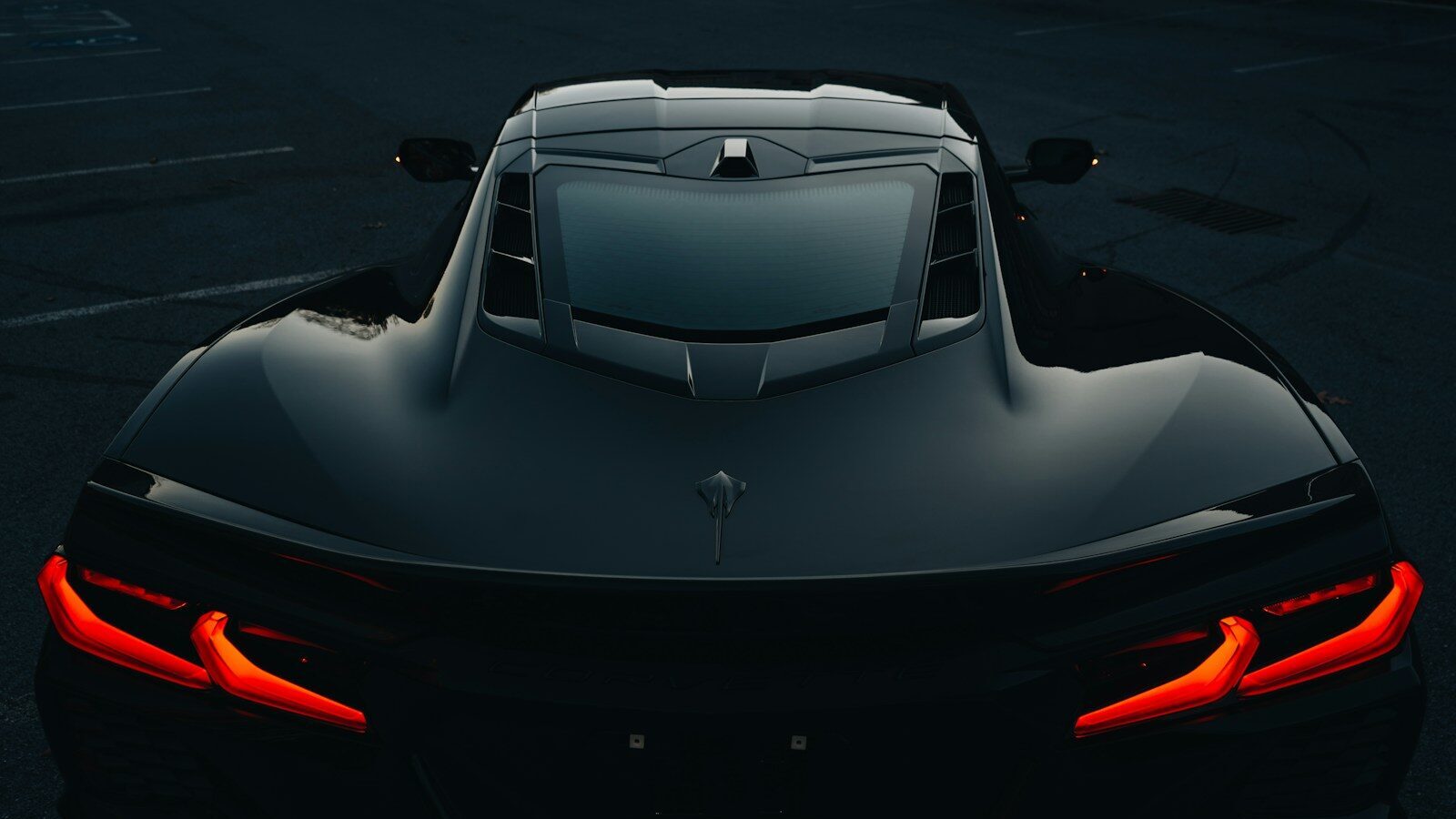 A black sports car parked in a parking lot