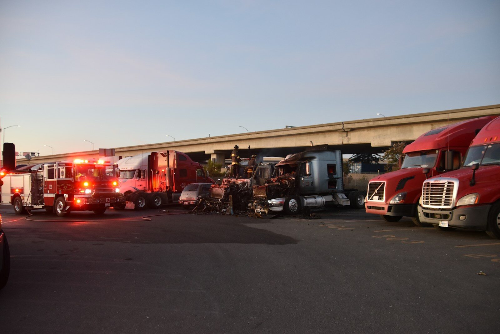 a group of semi trucks parked next to each other