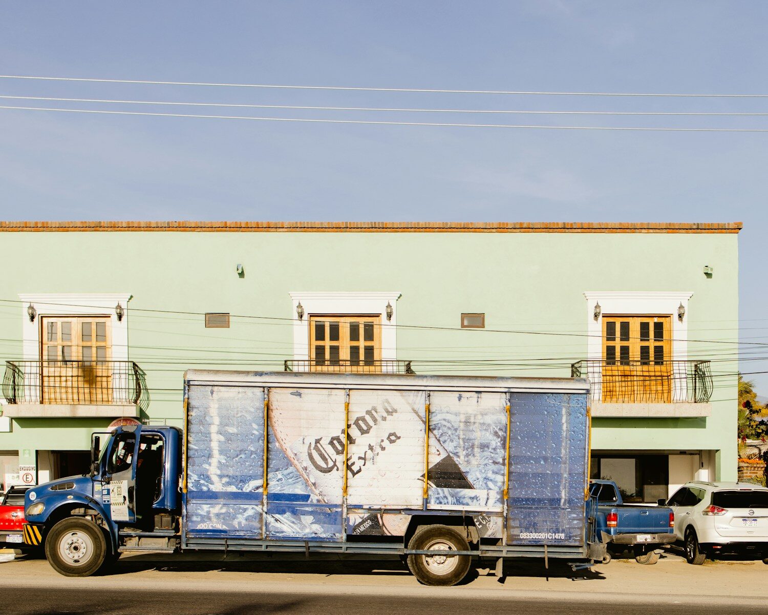 a semi truck parked in front of a building