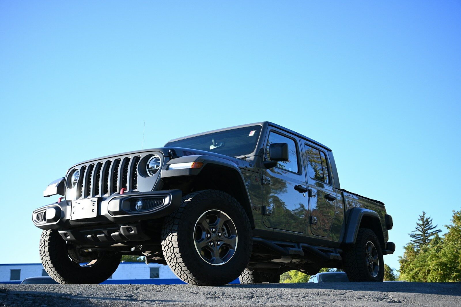 a black jeep parked on the side of a road