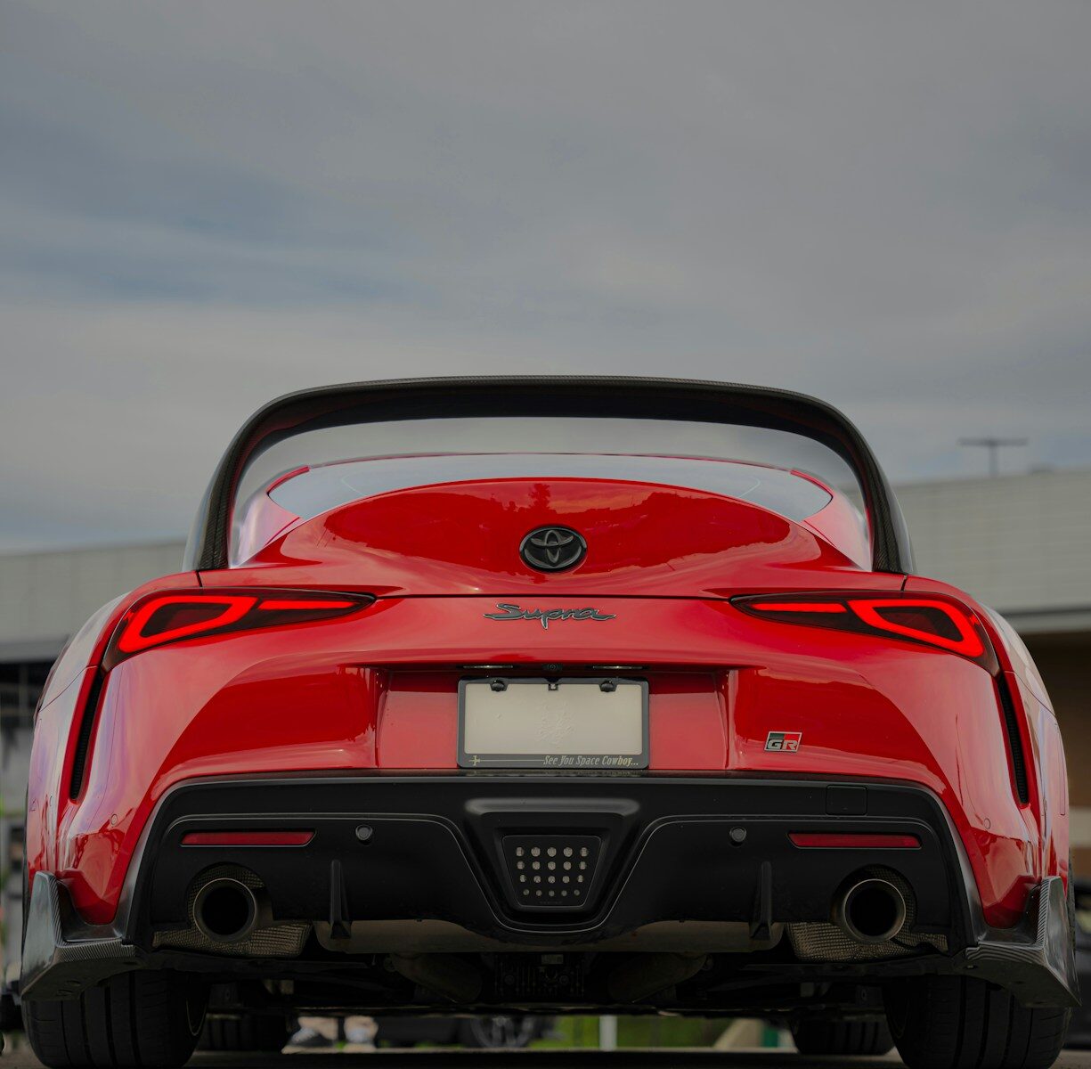the back end of a red sports car