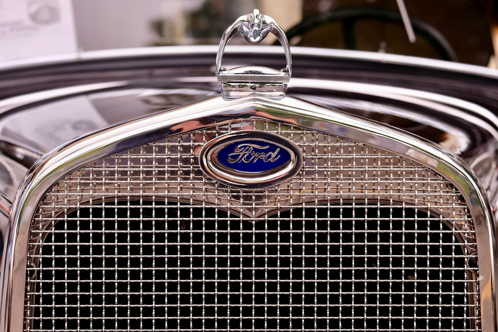 closeup photography of vintage black Ford vehicle