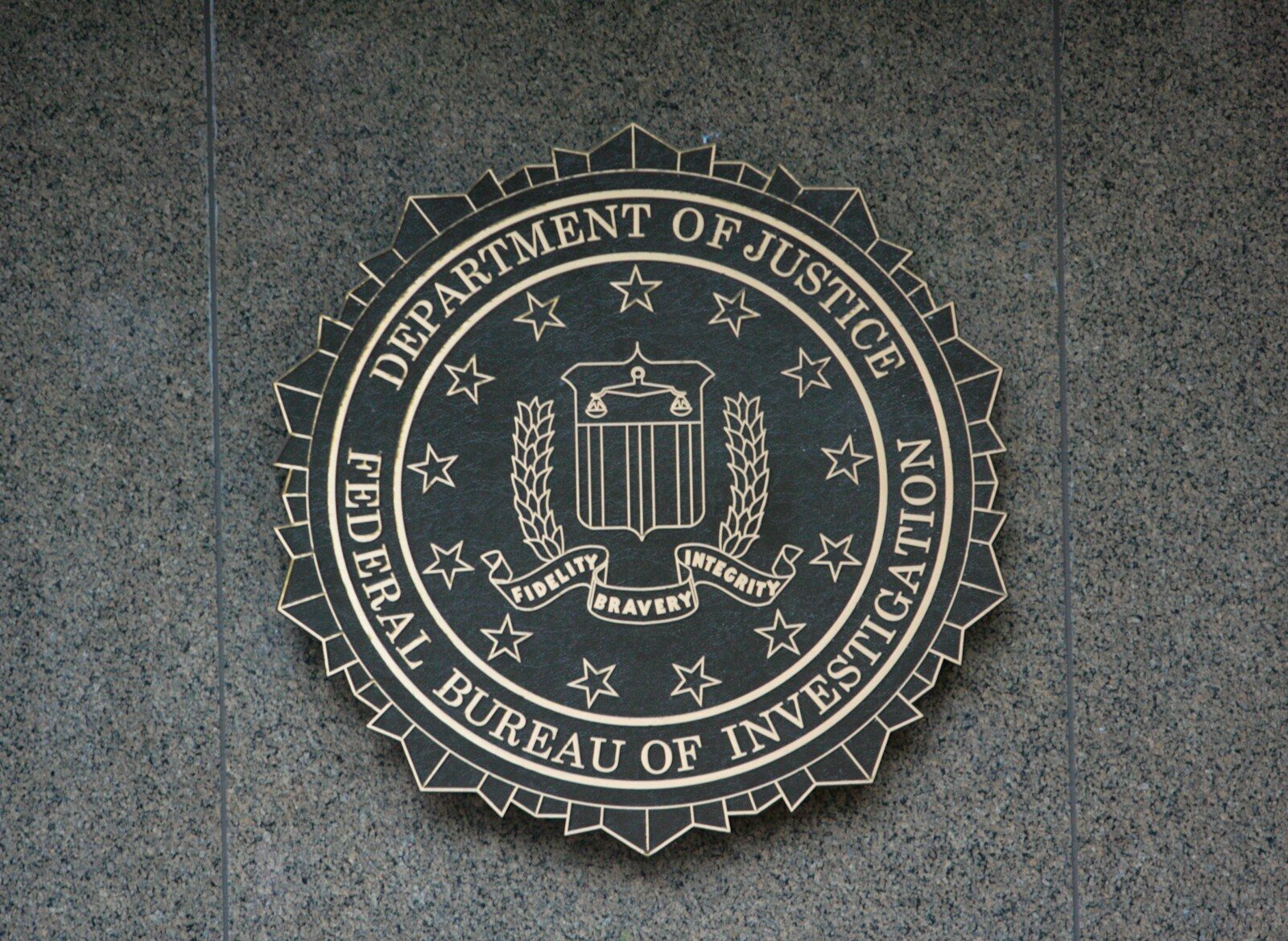 the seal of the department of justice on a wall
