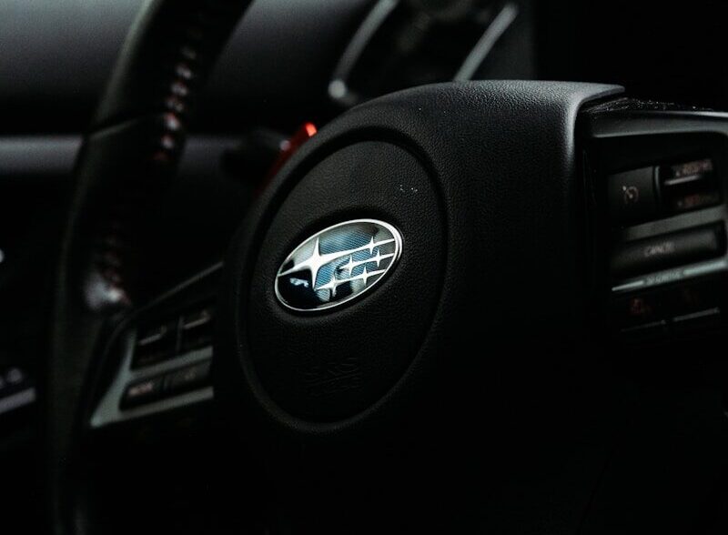 black nissan car steering wheel