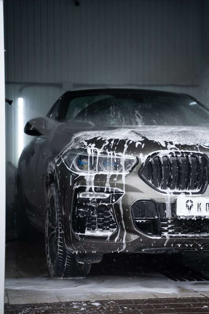 Car covered in wash foam at a car wash