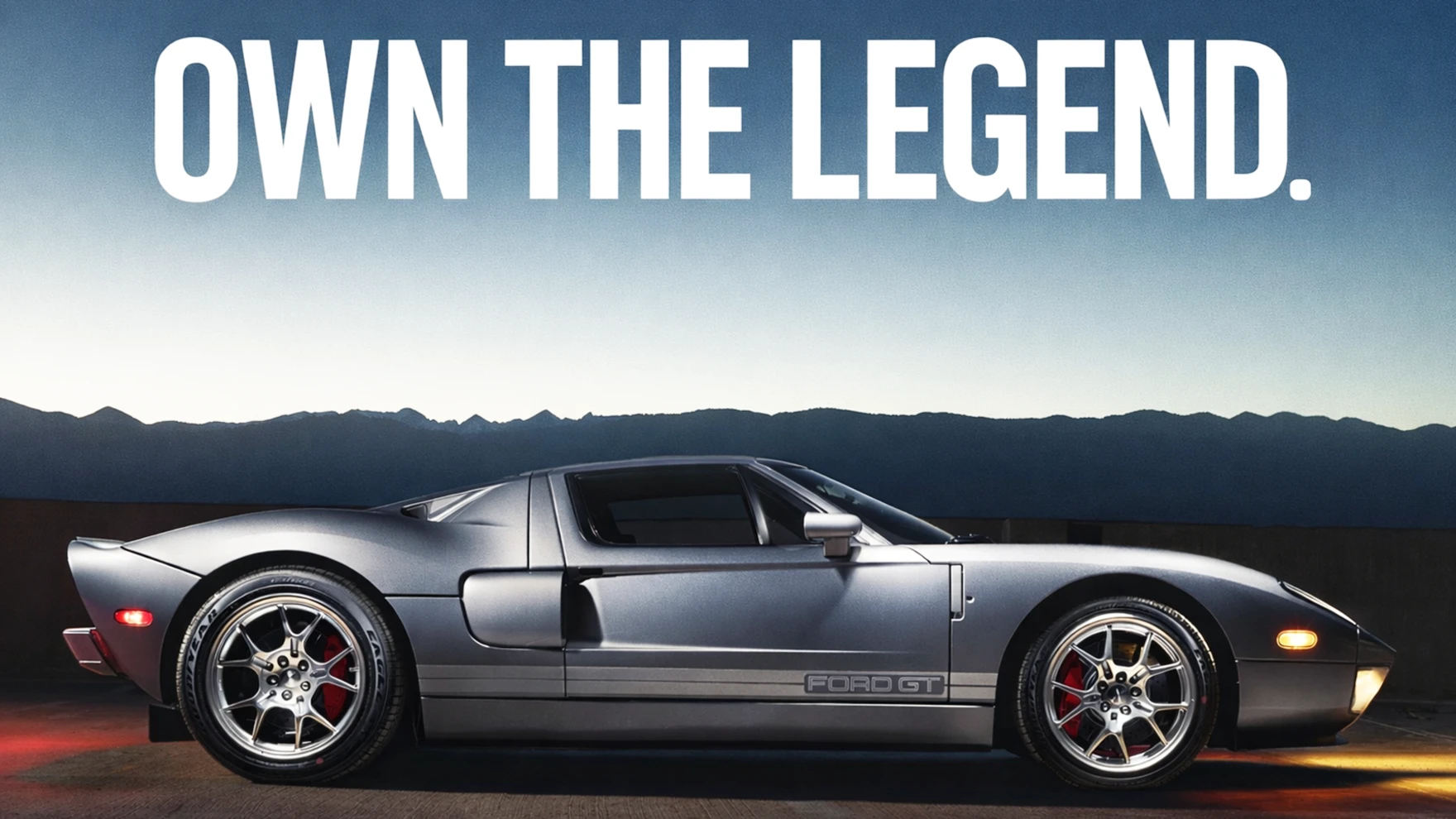 Tungsten Grey 2006 Ford GT giveaway car with Own the Legend text