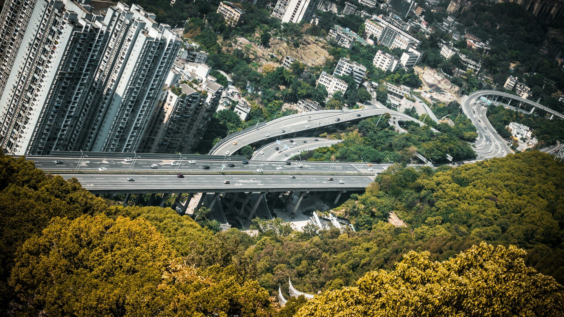 an aerial view of a highway in a city