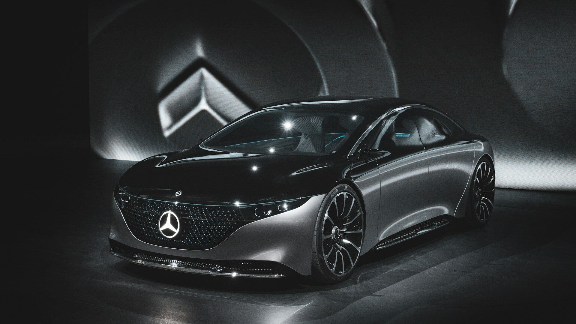 Mercedes-AMG front grille and badge on a dark performance sedan