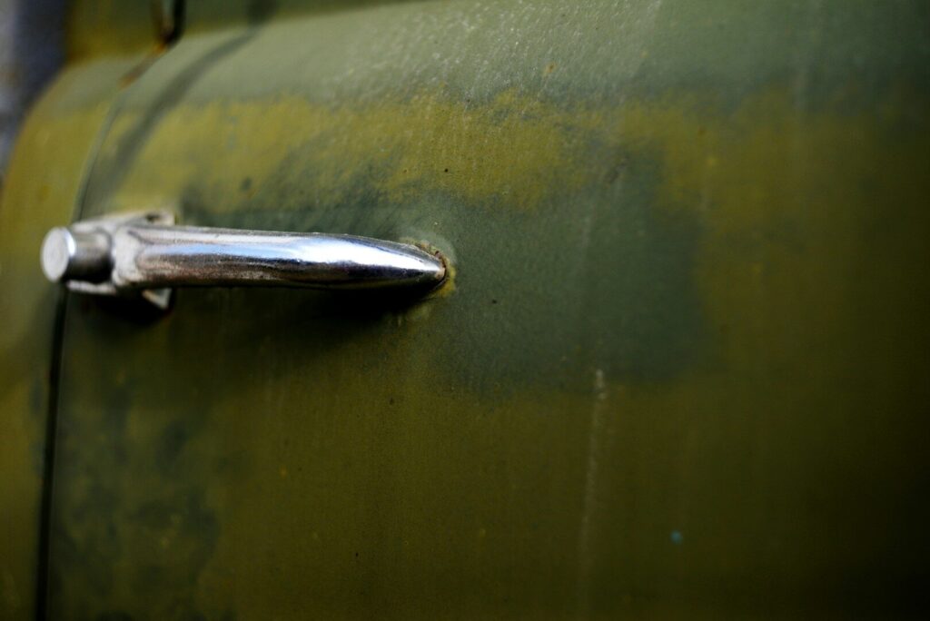 Close-up of a vintage car door handle