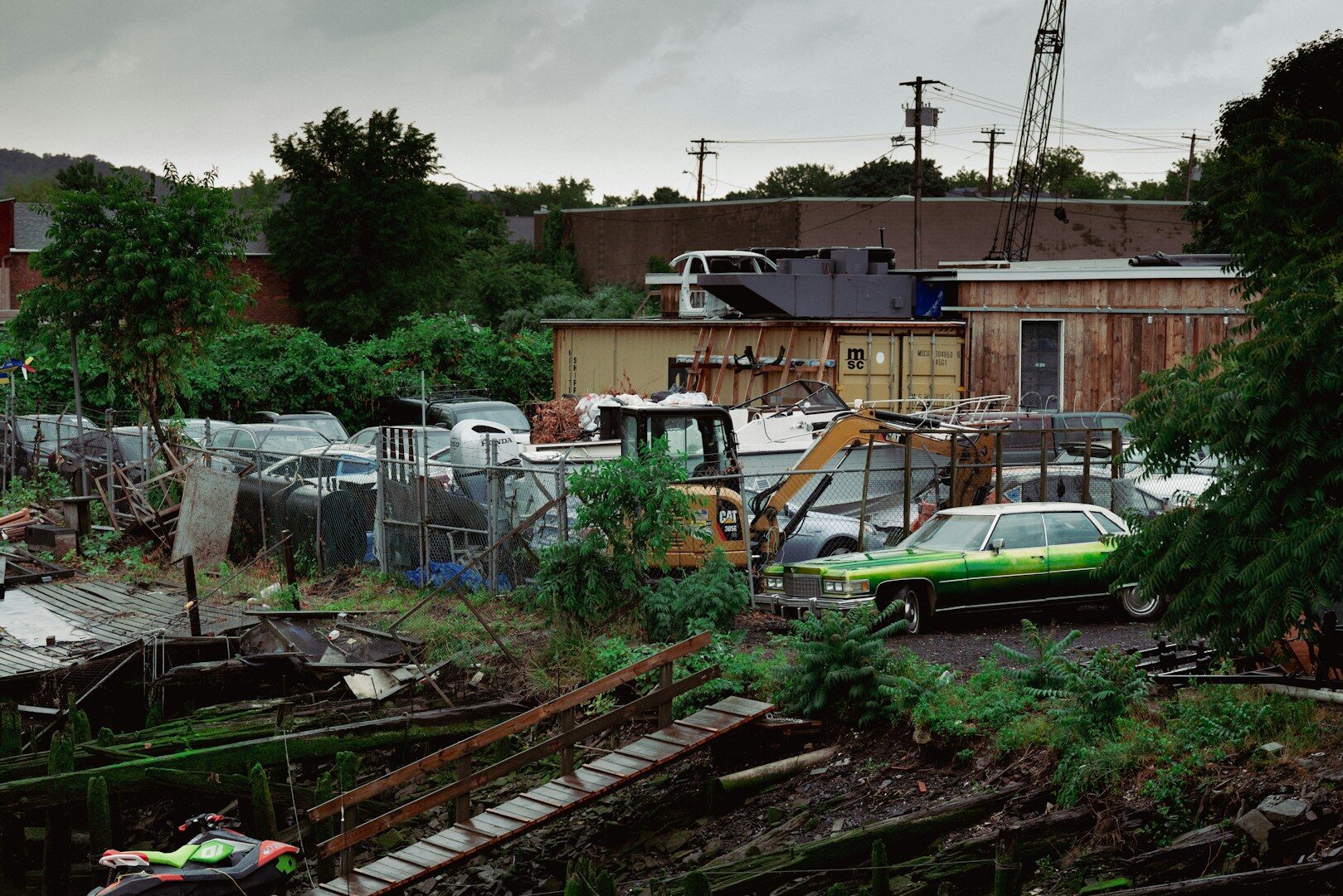A bunch of cars that are sitting in the dirt