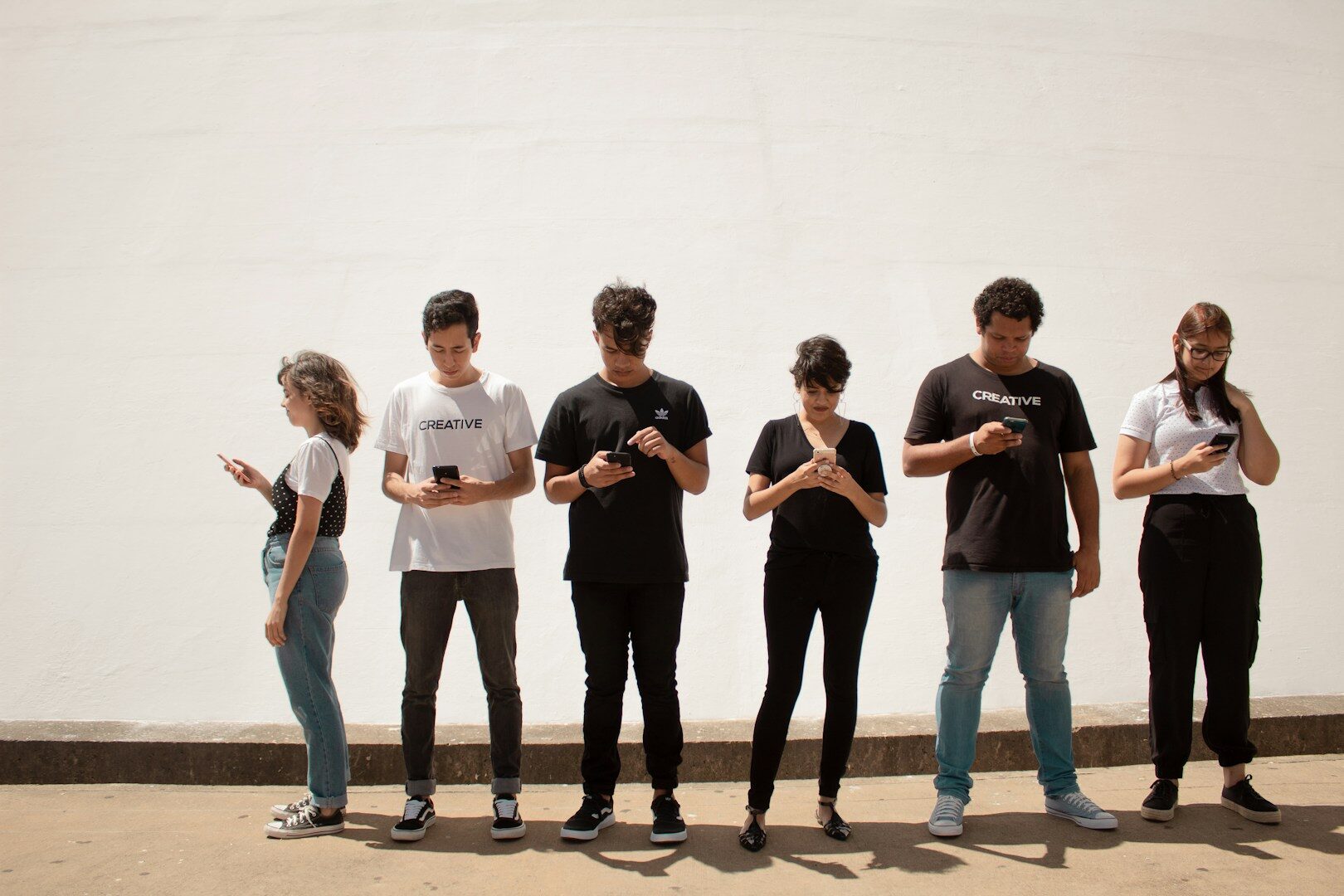 Group of 16-year-olds standing together, representing the driving decline trend