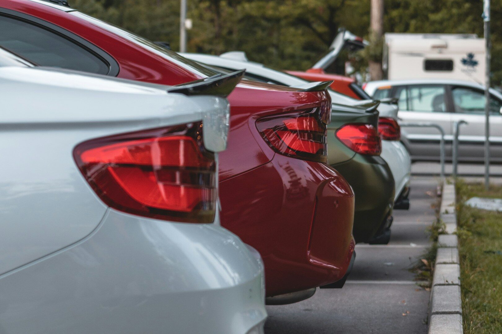 Row of used cars for sale on a dealership lot