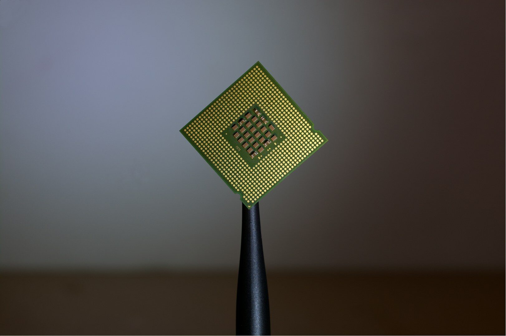 Silicon carbide semiconductor chip held with tweezers, the type of power electronics component at the center of Bosch's Roseville, California investment