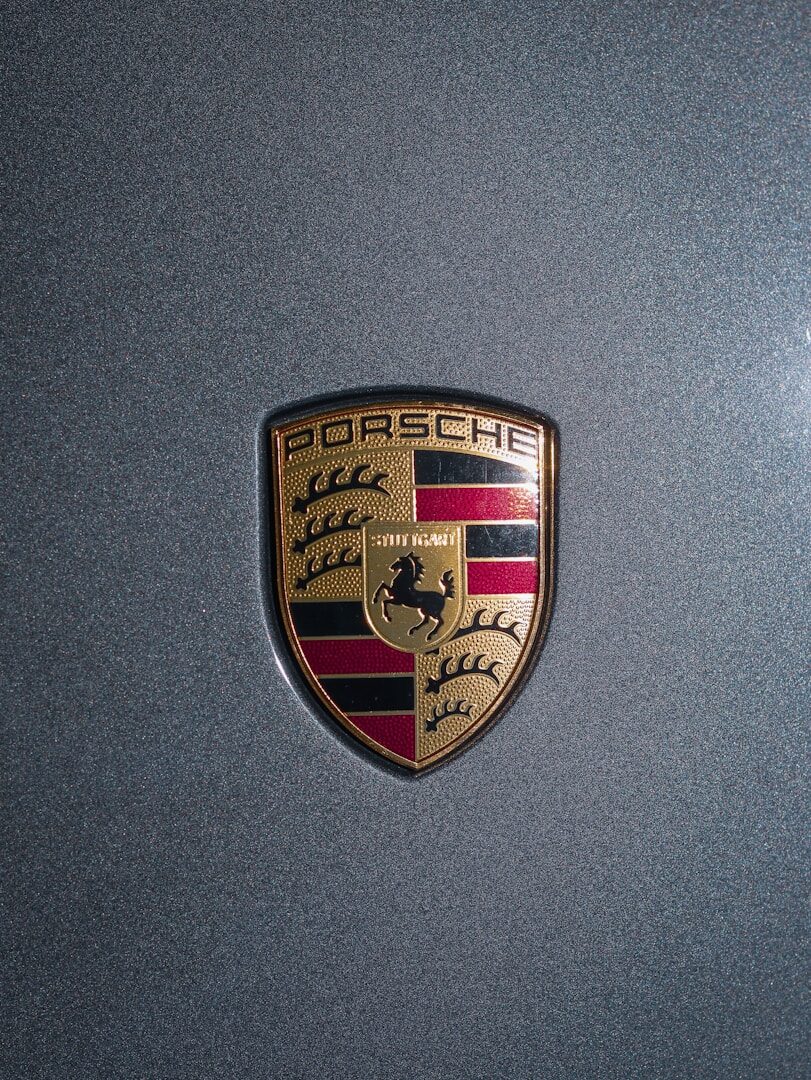 a close up of a porsche emblem on a car