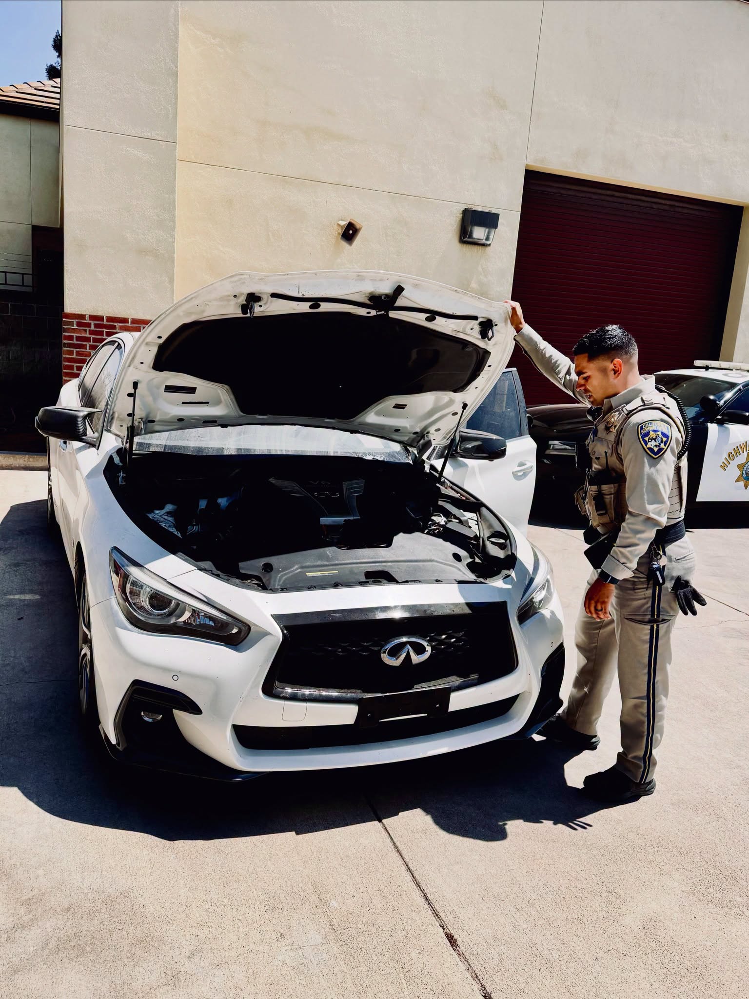 A black Infiniti recovered by the California Highway Patrol after officers identified it as a VIN-switched stolen vehicle