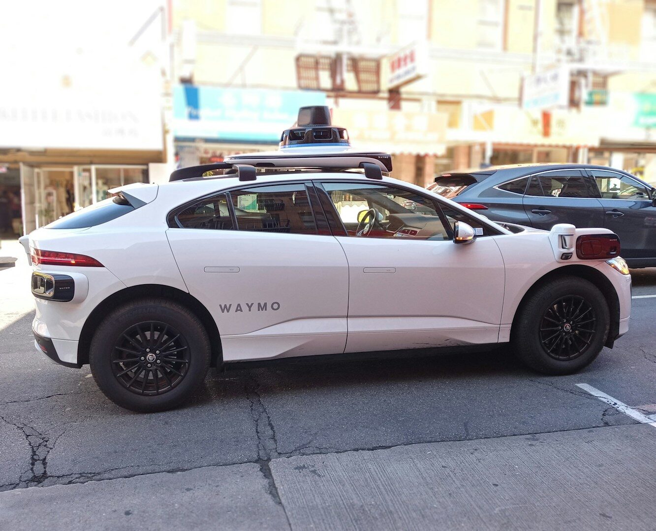 A waymo self-driving car is seen in the city