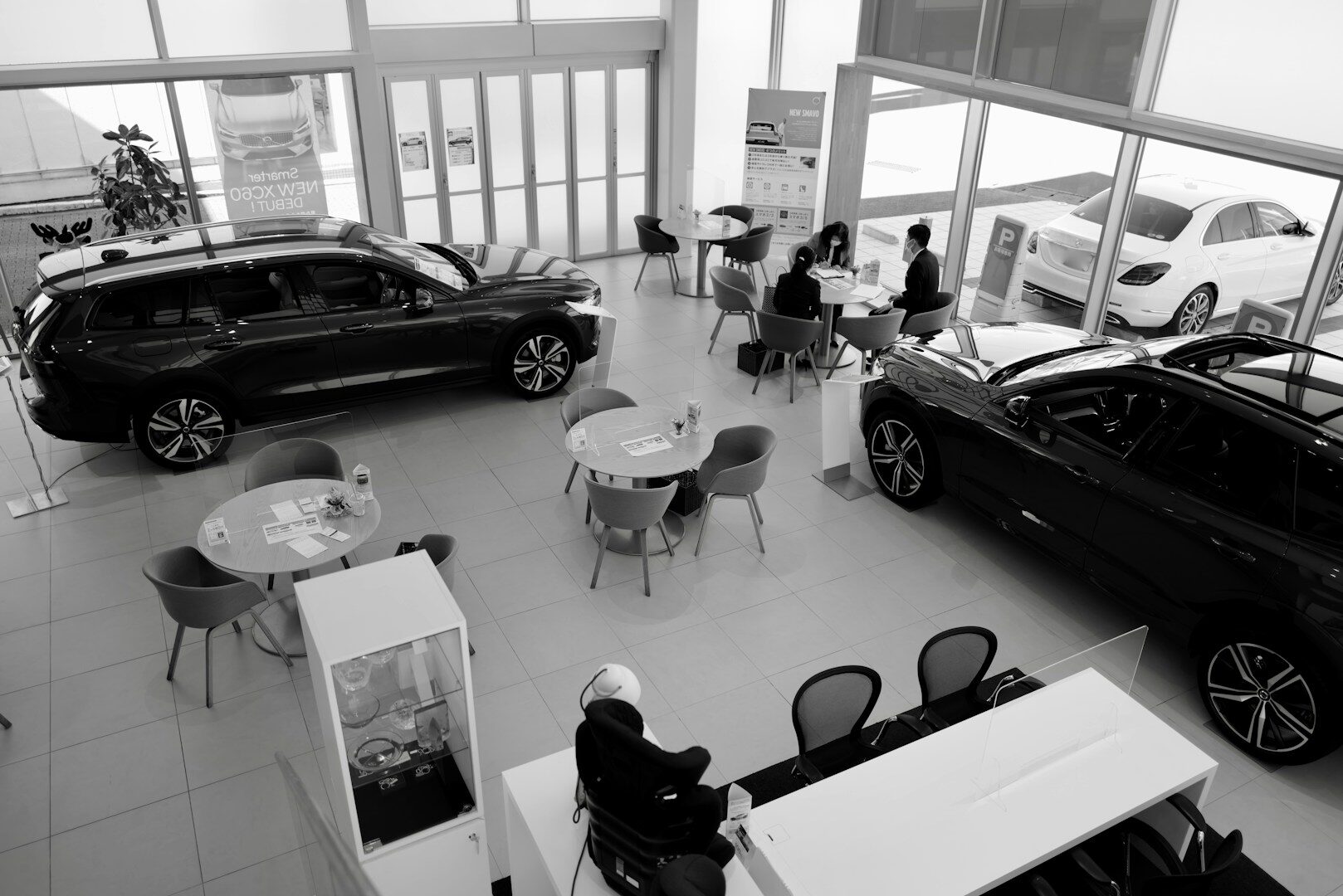 Car dealership showroom finance office where auto loan paperwork is signed