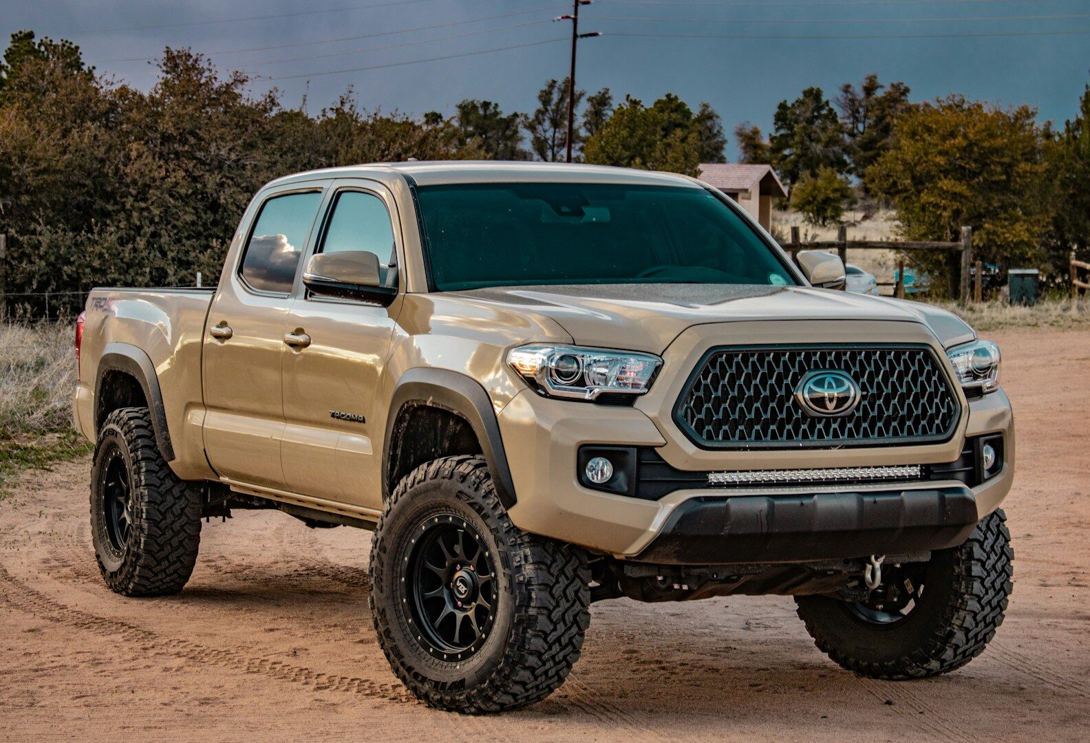 2024 Toyota Tacoma TRD Off-Road pickup truck, the trim affected by the shock absorber recallwhite Toyota crew cab pickup truck on ground