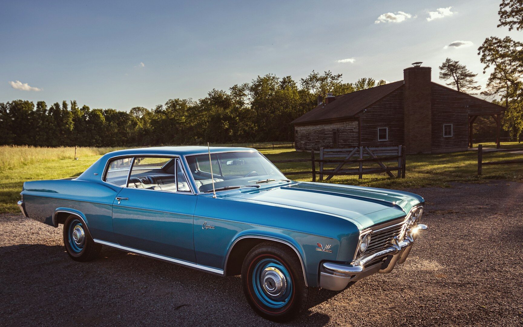 A blue car parked on the side of the road