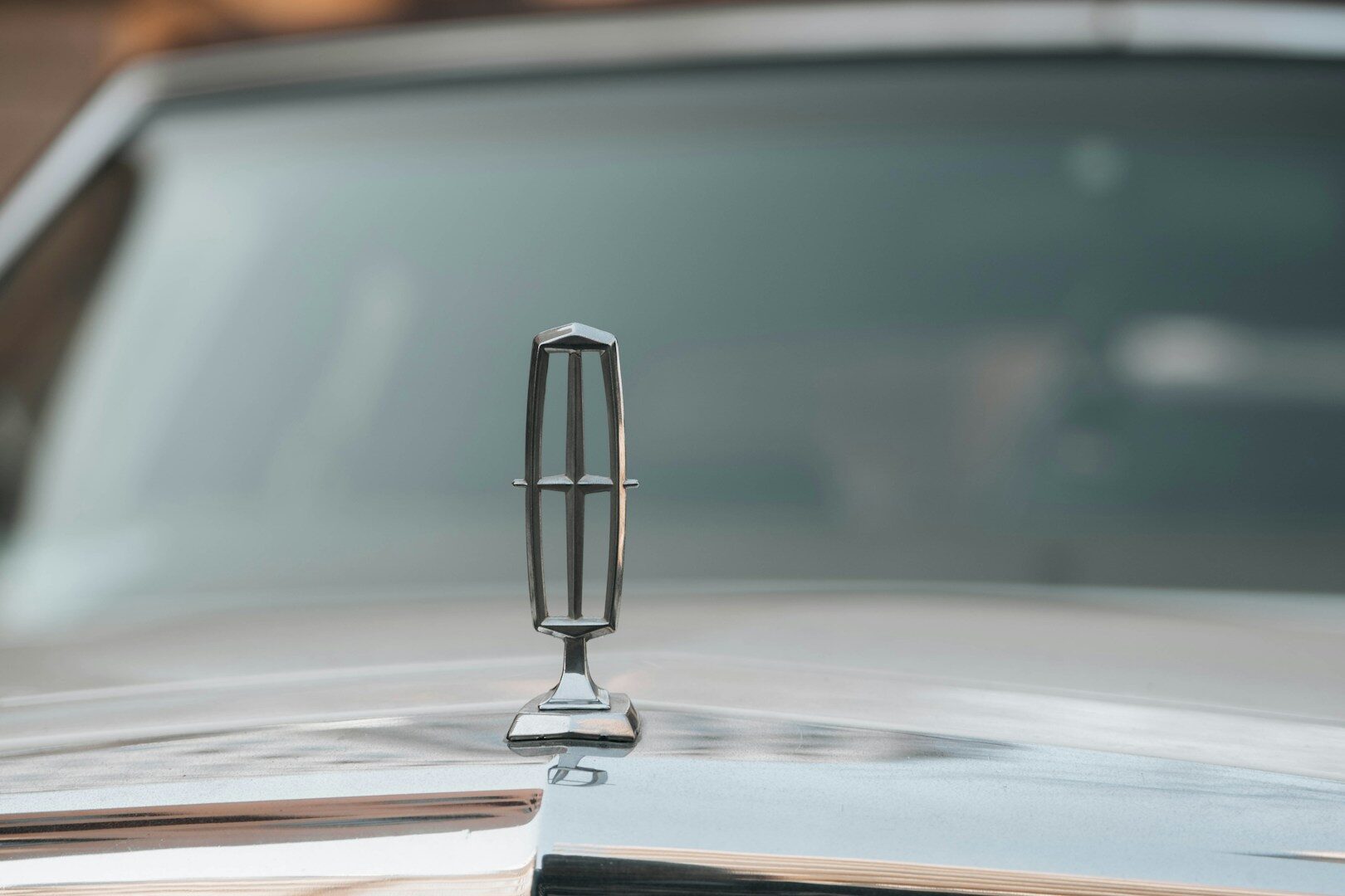 a close up of the hood ornament of a classic car