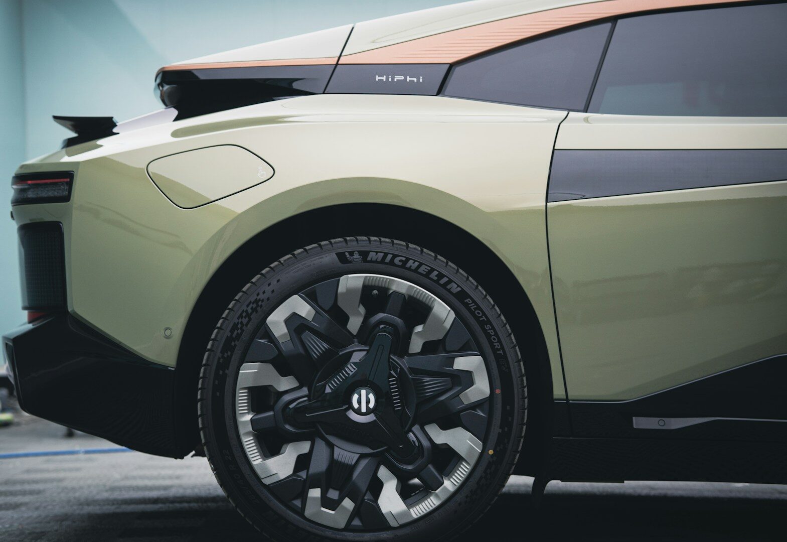 a close up of the front wheels of a sports car