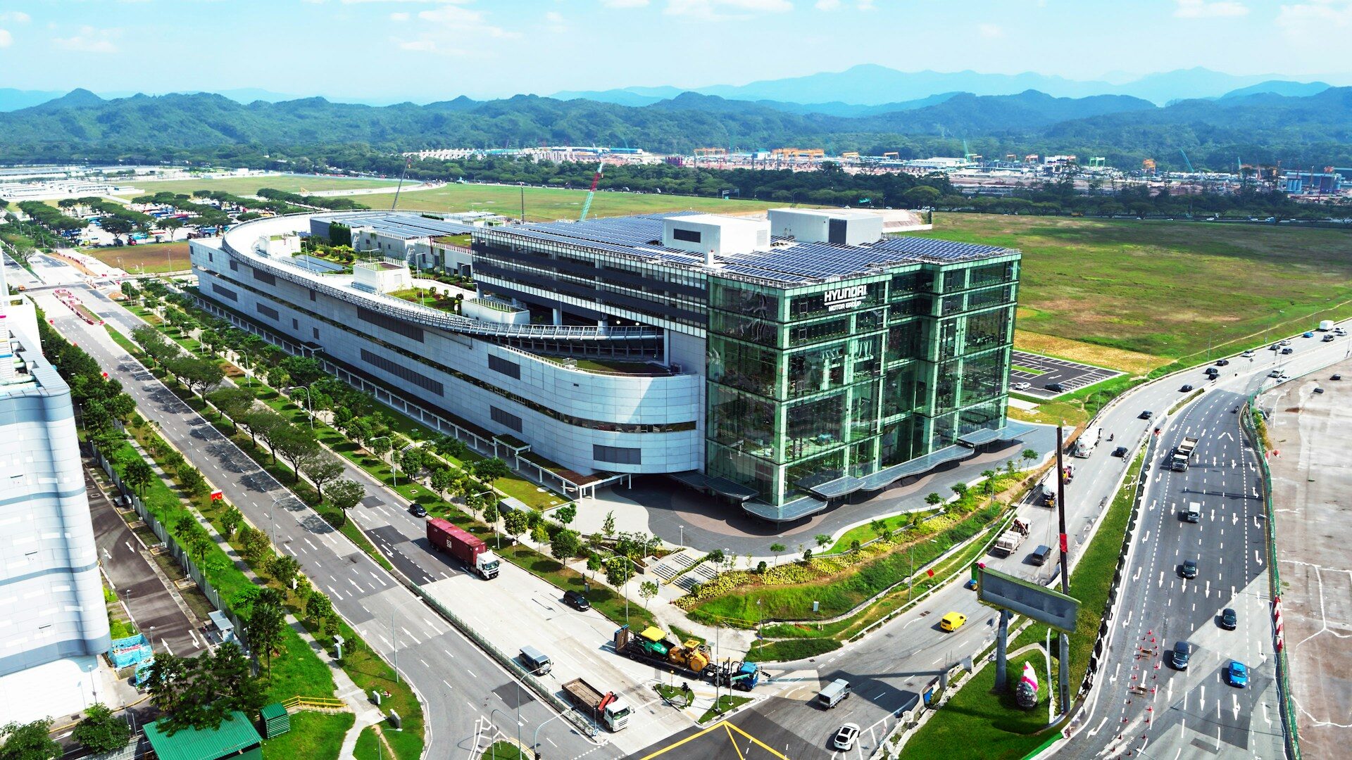 an aerial view of an airport with a large building