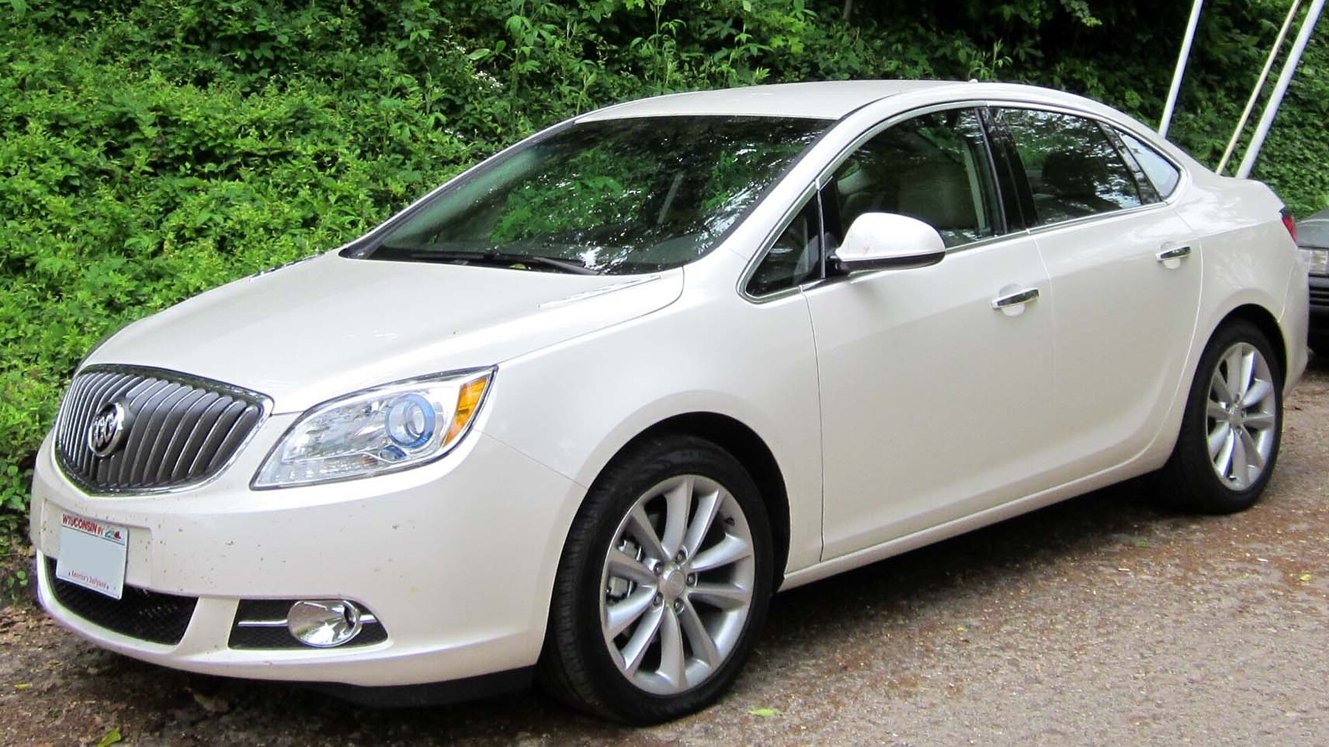 White Buick Verano compact sedan parked on a street