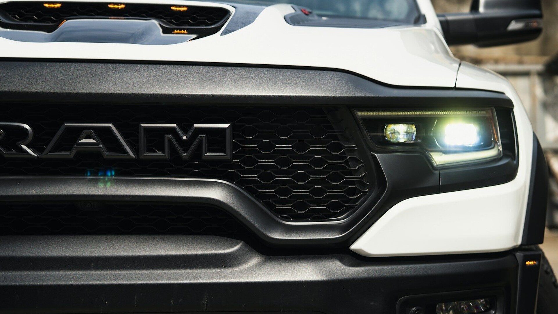a close up of the front of a white truck