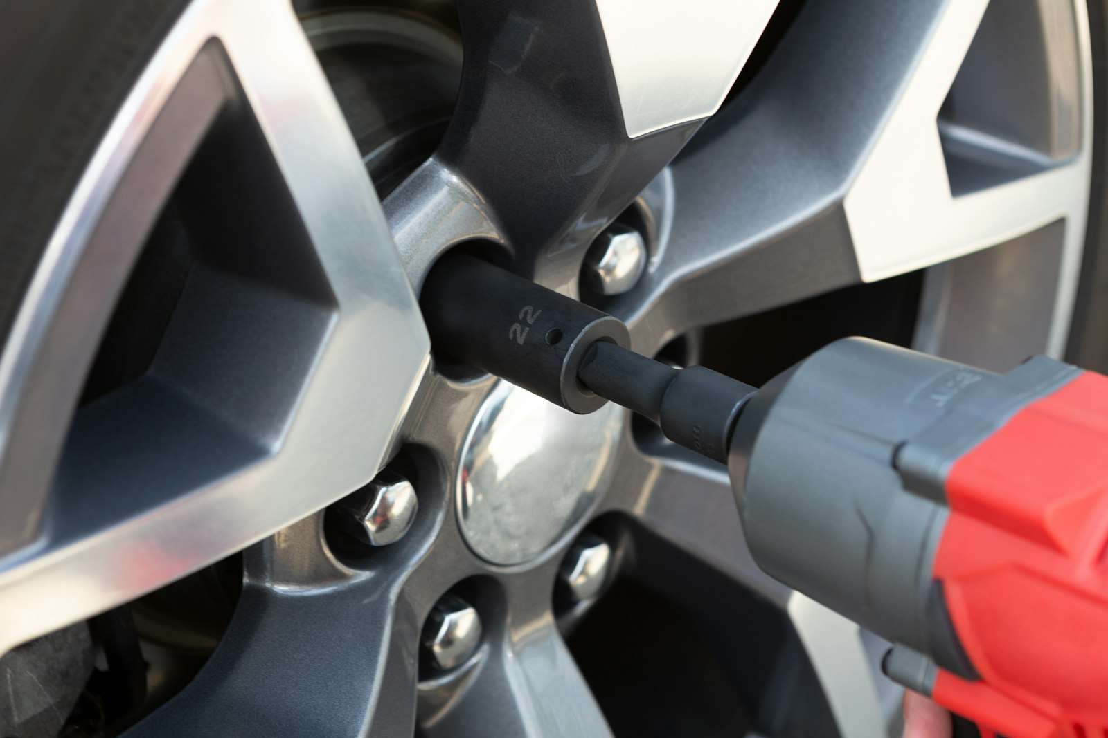 Car wheel and lug nuts during tire service