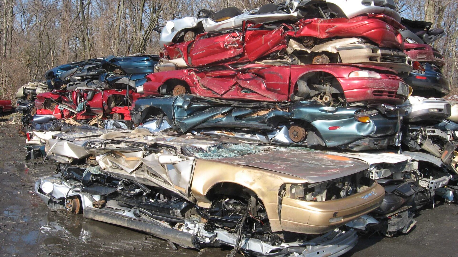 Crushed cars stacked at an auto scrapyard, the fate Kentucky’s street racing bill would have allowed