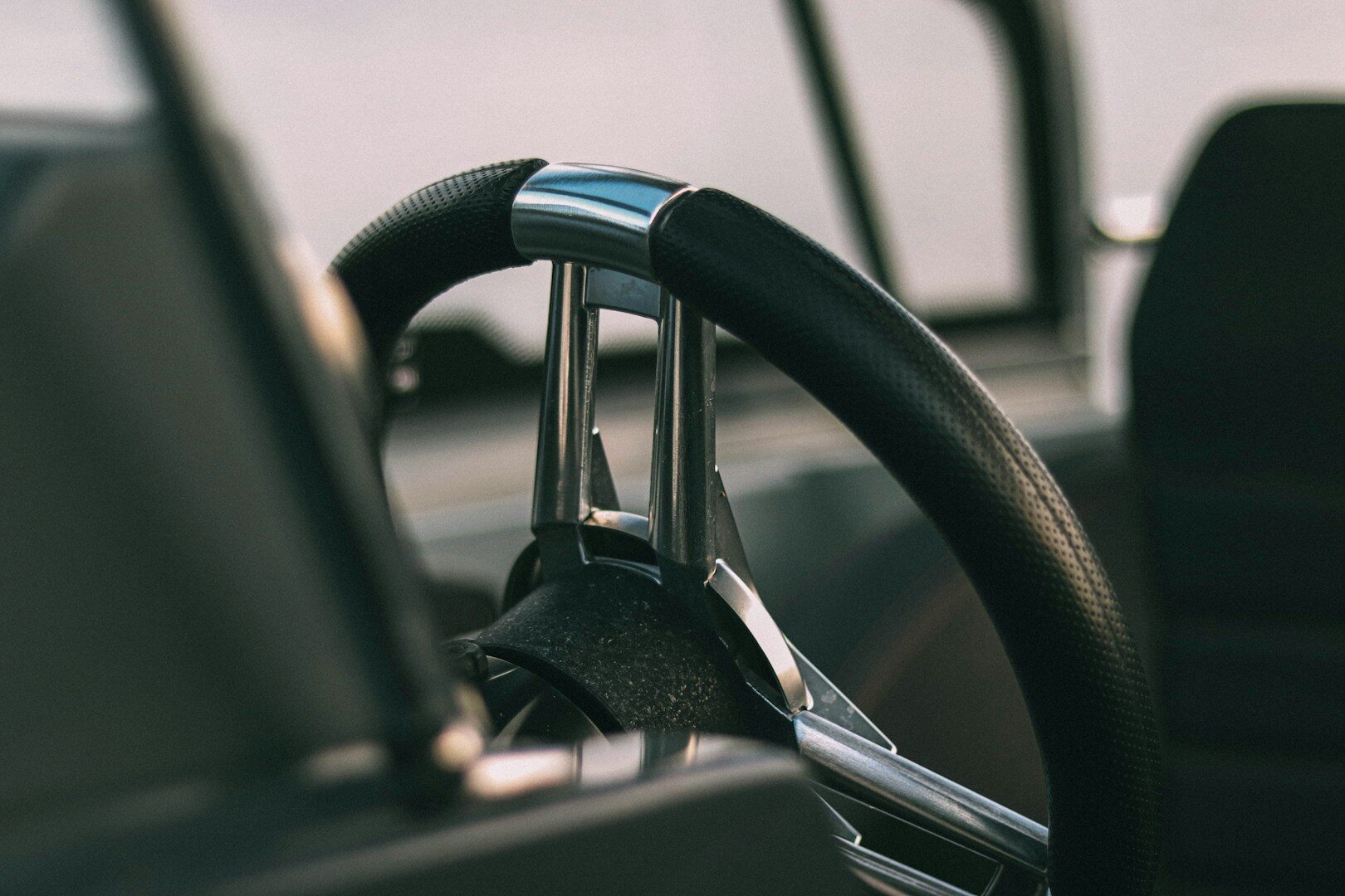 Close-up of a car's steering column and ignition, representing the Kia and Hyundai theft-lawsuit story