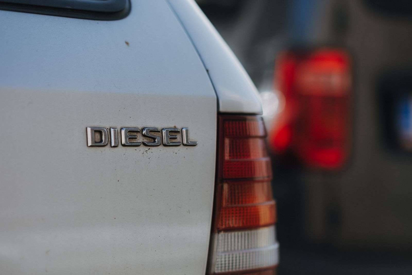 Close-up of a chrome 'Diesel' badge on the back of a car