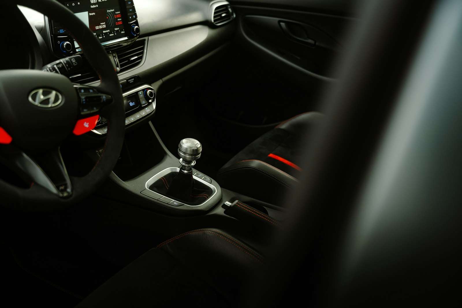 Hyundai steering wheel and digital cockpit in a dim car interior