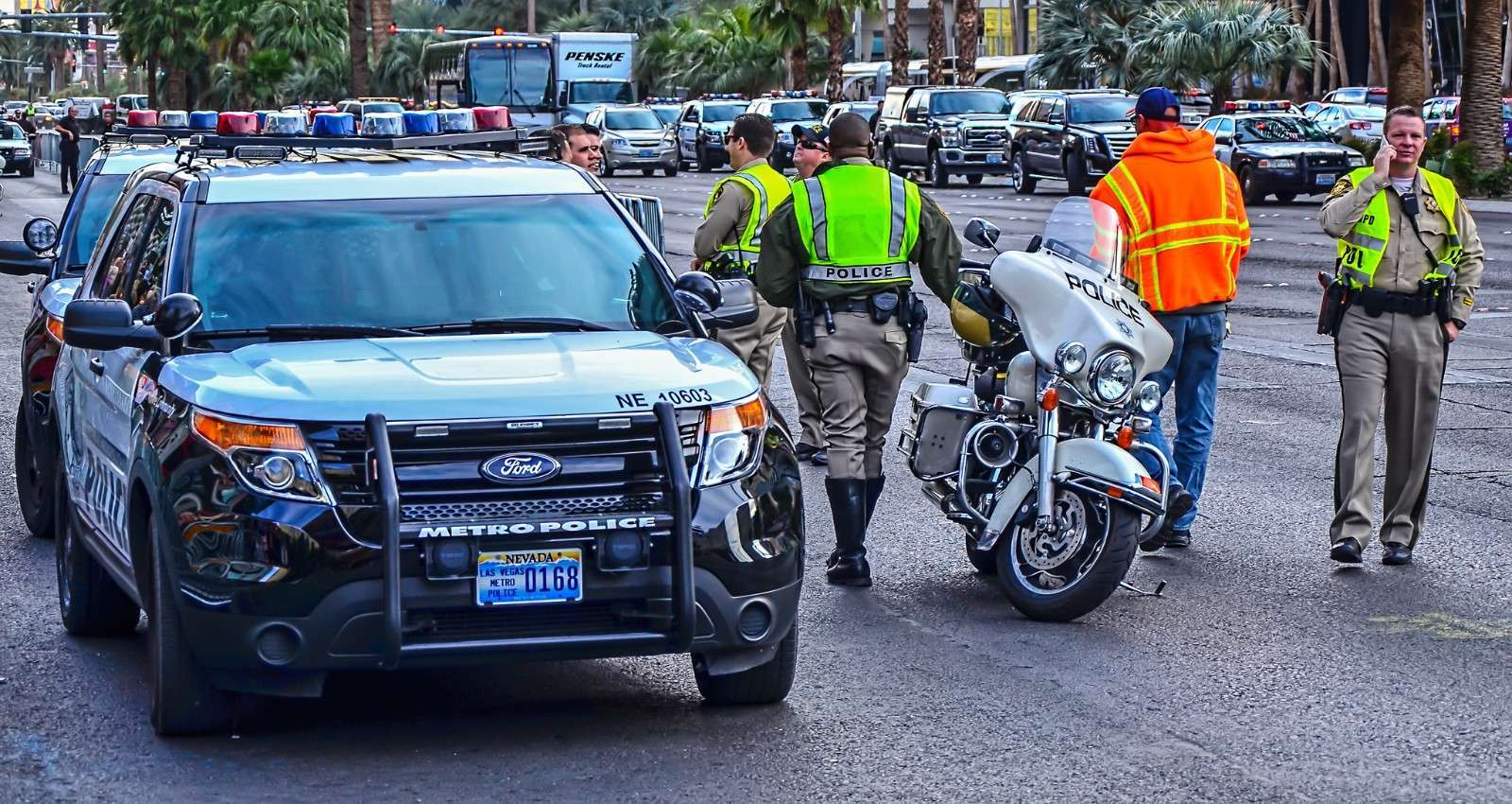 Las Vegas Metropolitan Police Ford Explorer patrol vehicle with officers and a police motorcycle on a Las Vegas street