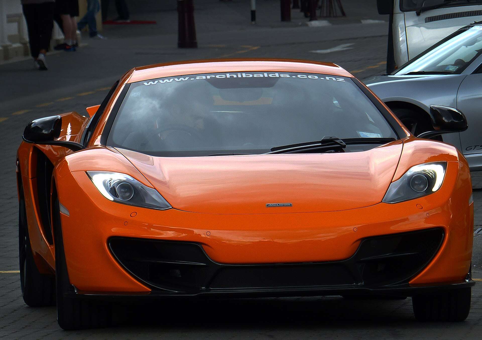 Orange McLaren MP4-12C supercar, the first series-production McLaren to use a Ricardo-built engine