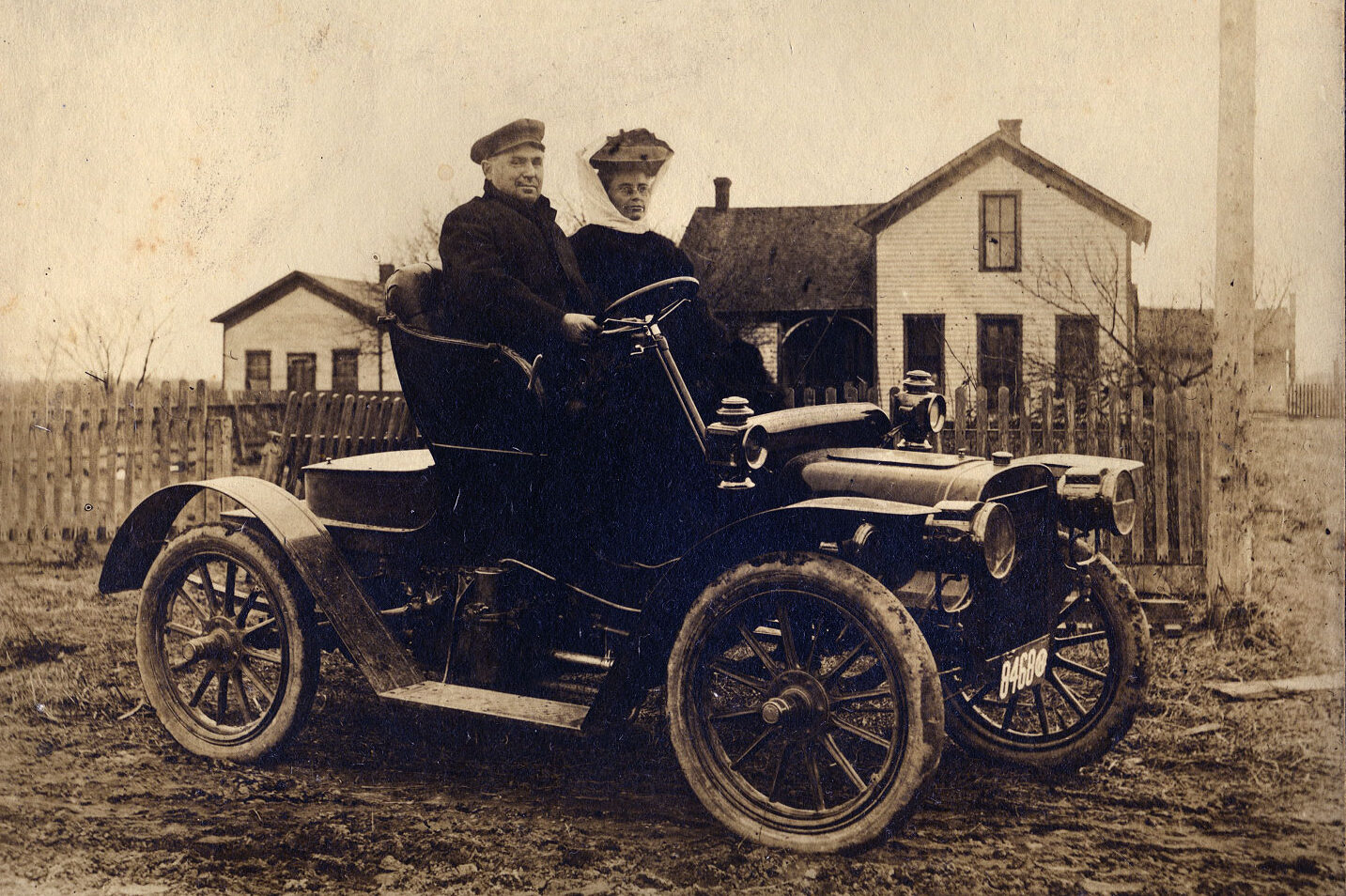An Ohio couple posing in their 1908 Cadillac Model S touring car