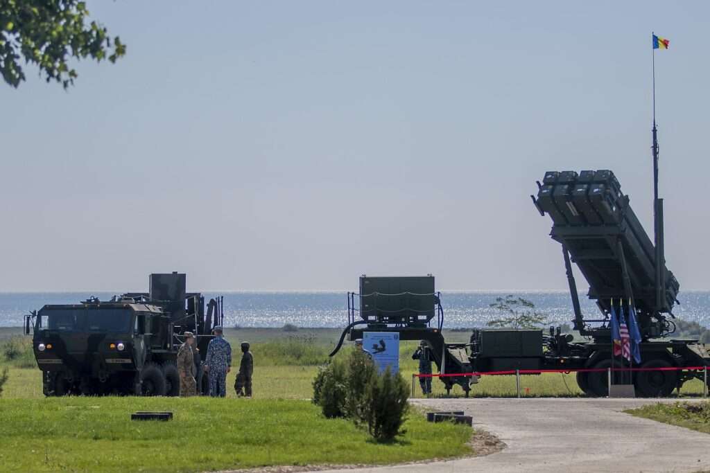 U.S. Army and Romanian soldiers beside a Patriot missile launcher at the Capu Midia training area in Romania