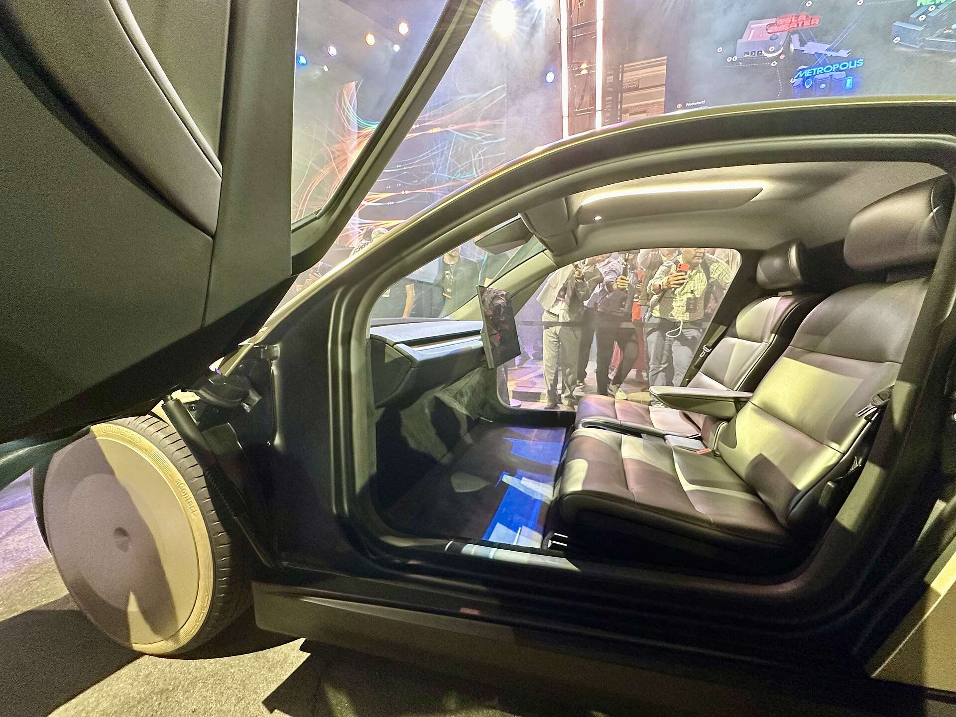 The two-seat cabin of a Tesla Cybercab, with a screen and no steering wheel or pedals