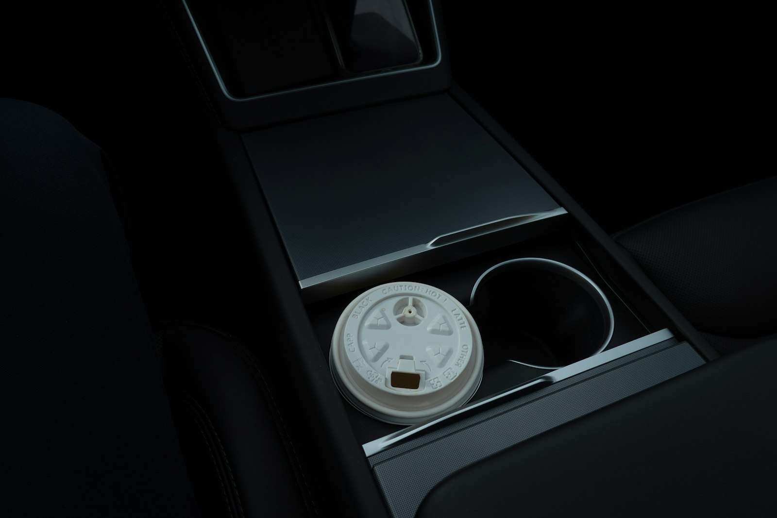 Disposable coffee cup in a car cup holder