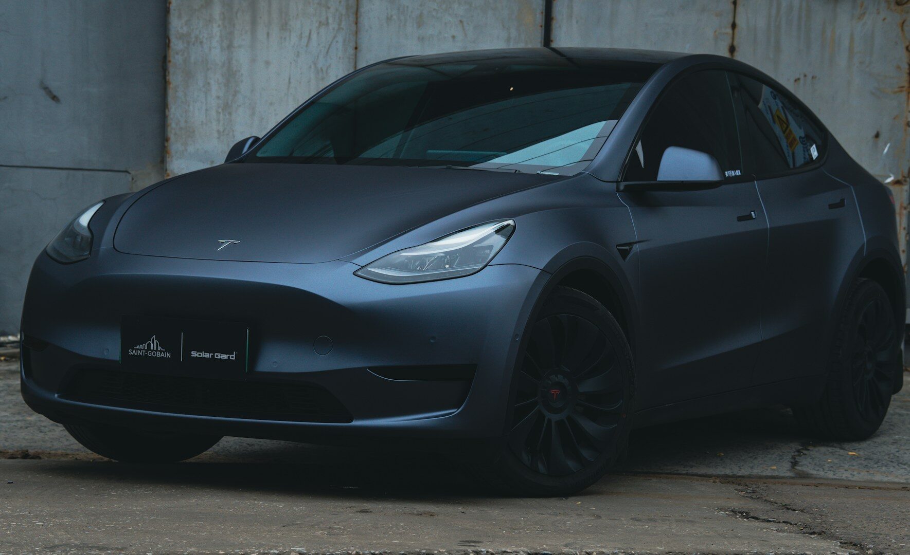 a black car parked in a garage