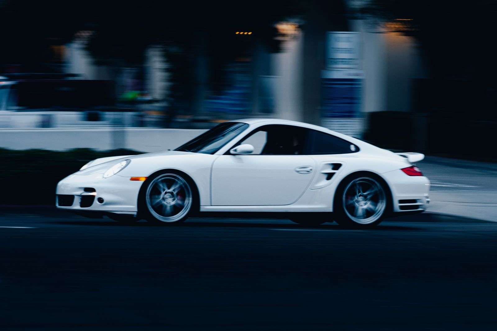 White Porsche 911 Turbo driving at night
