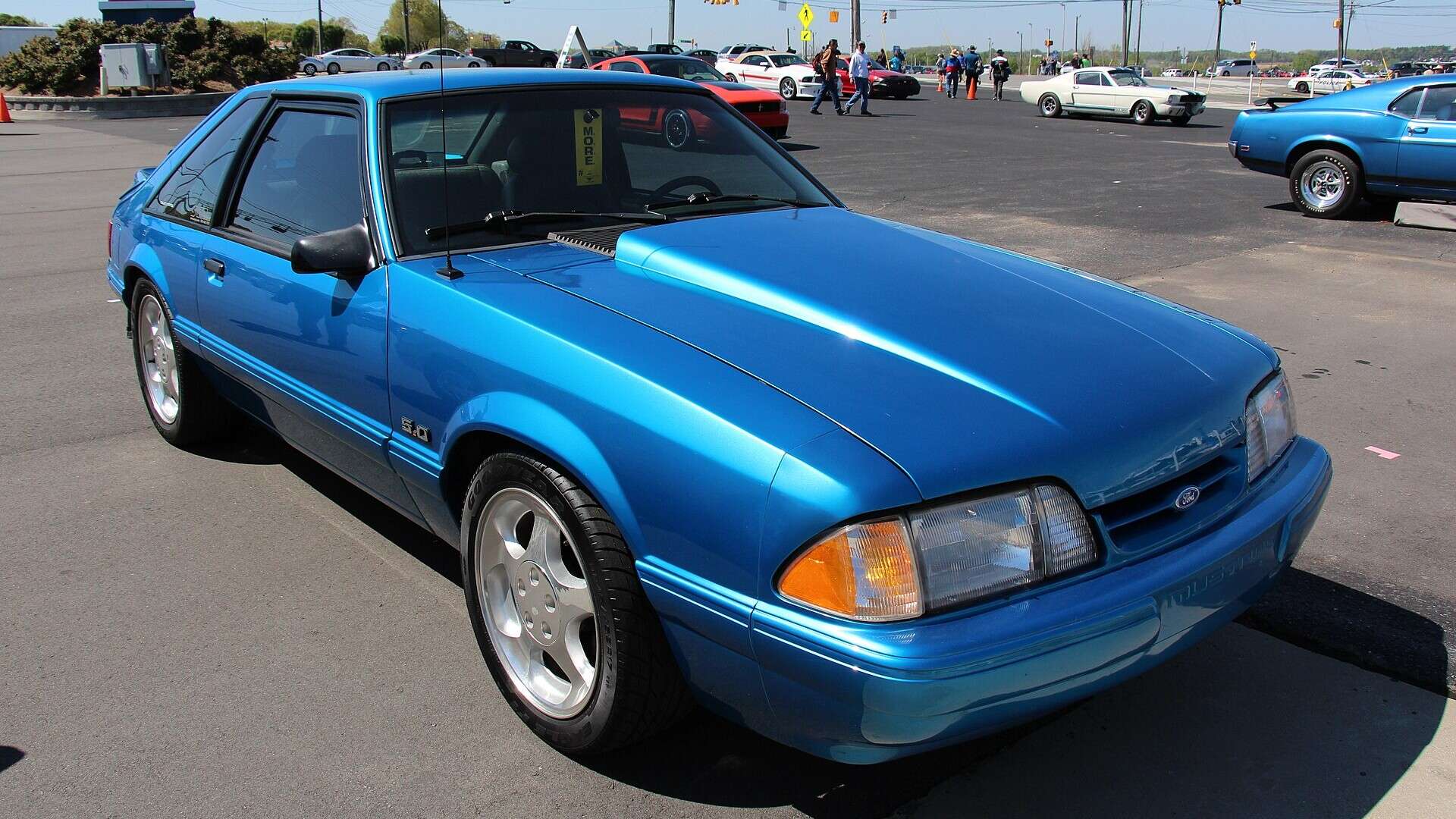Blue 1992 Ford Mustang LX hatchback parked at a car show