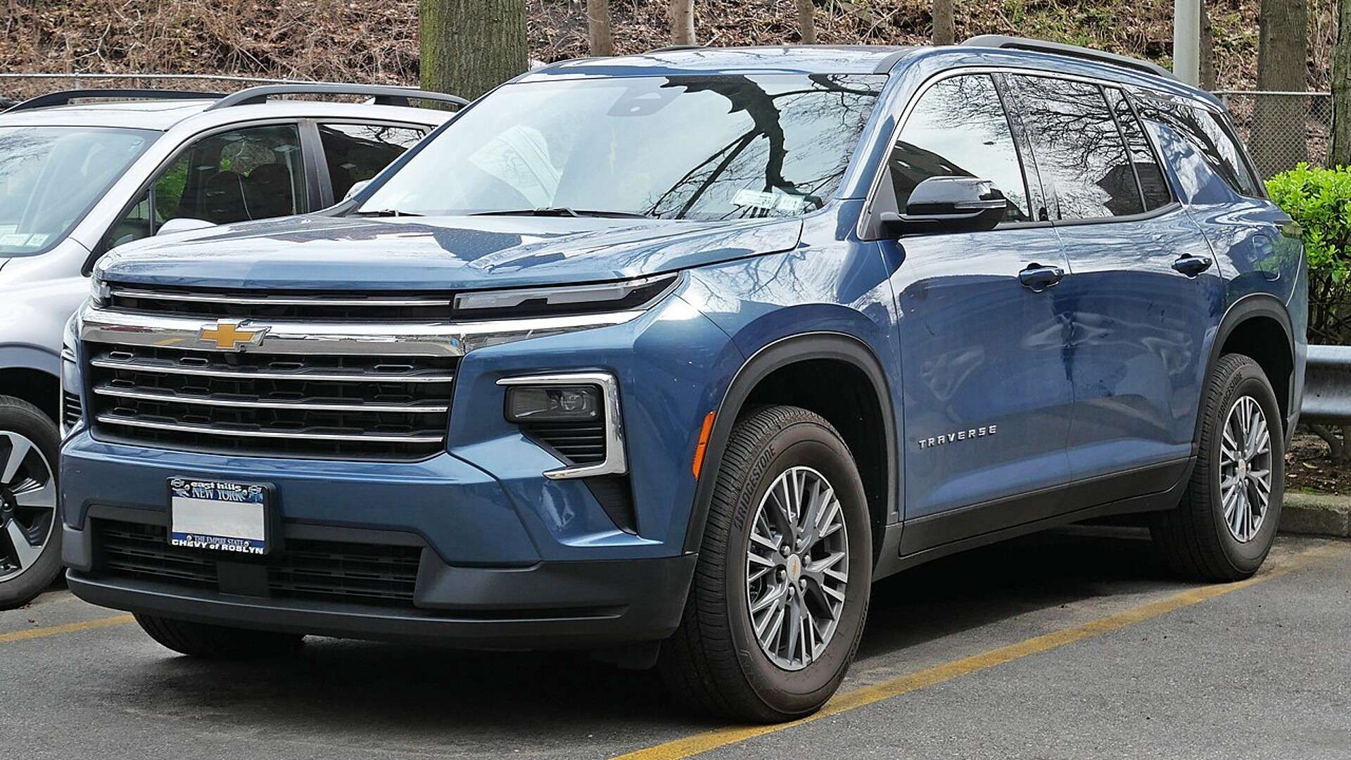 Front three-quarter view of a 2025 Chevrolet Traverse LT parked on a street in Queens, New York