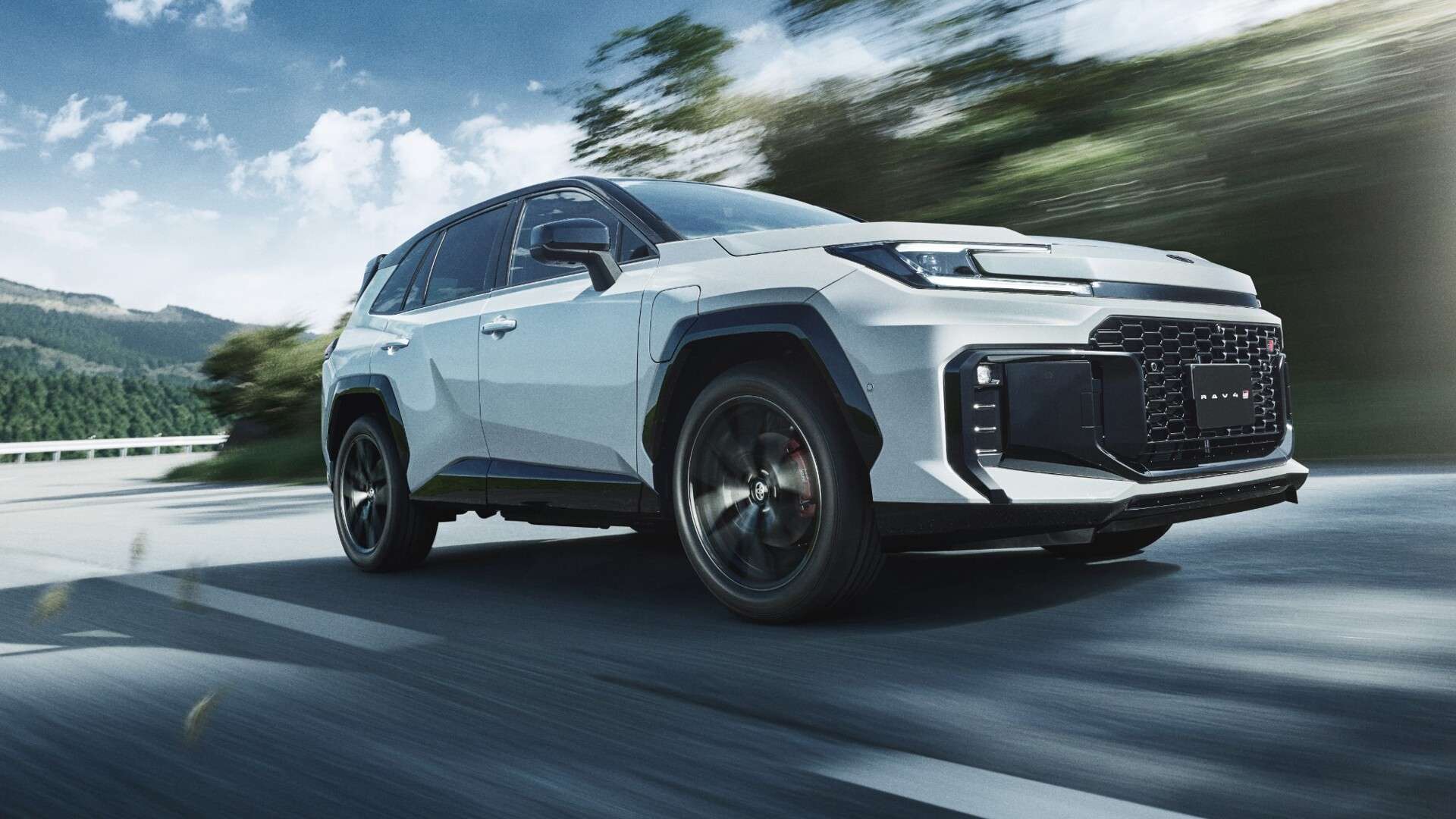 Toyota RAV4 plug-in hybrid driving on a mountain road
