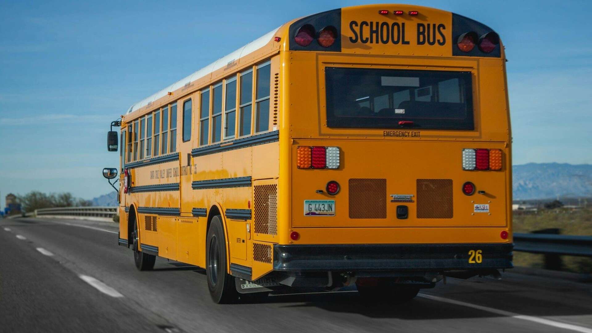 yellow school bus on road during daytime