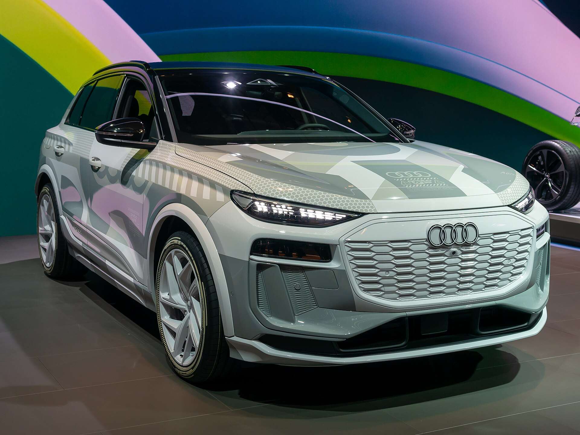 Camouflage-wrapped Audi Q6 e-tron electric SUV on display at the IAA Mobility show in Munich