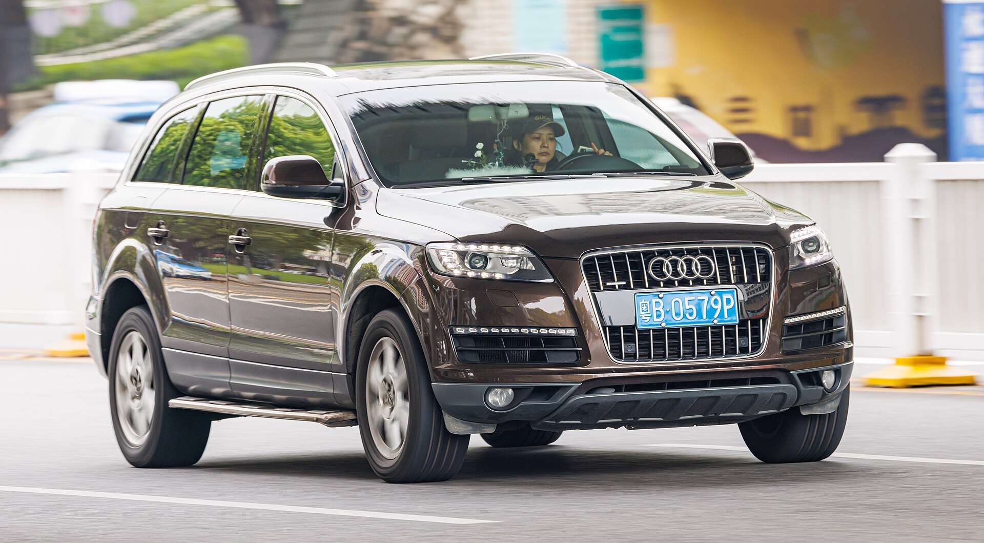 Audi Q7 three-row SUV parked on a street