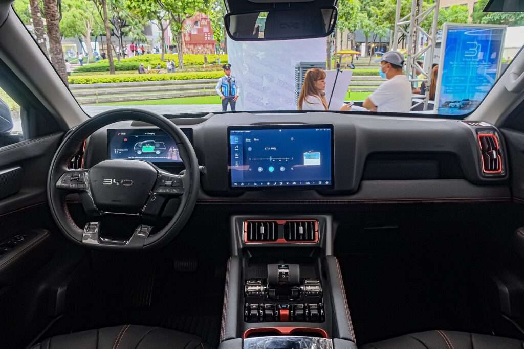 Dashboard and center touchscreen of a BYD Shark 6 DMO plug-in hybrid pickup