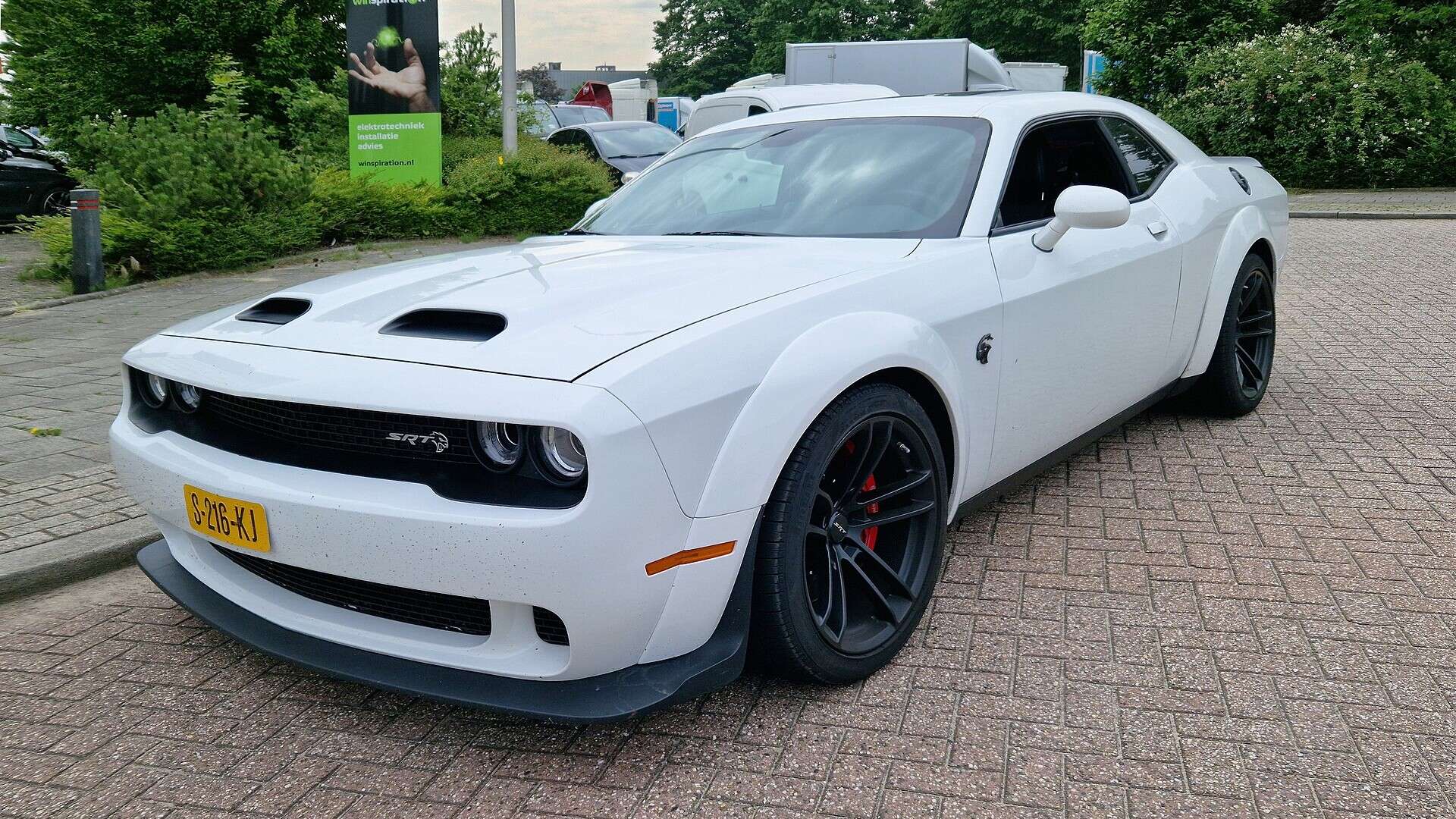 White Dodge Challenger SRT, three-quarter front view